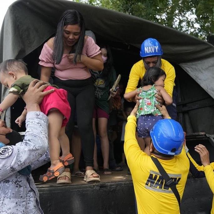 Philippine villagers flee ashfall, sight of red-hot lava from erupting Mayon Volcano